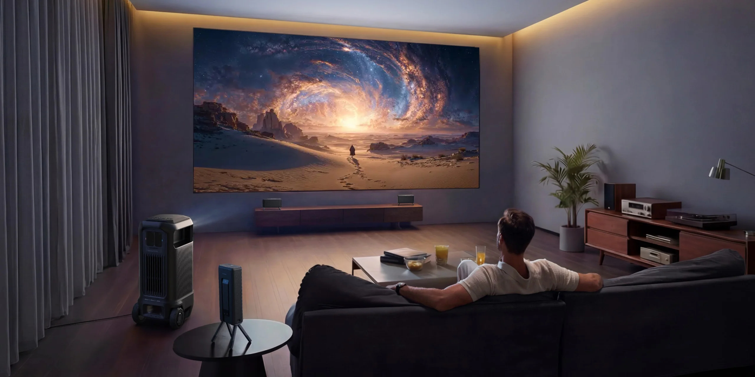 Indoor movie night setup with projector and large screen